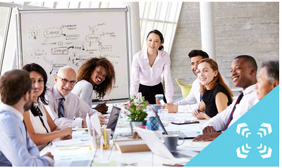 Group of staff sitting around conference table